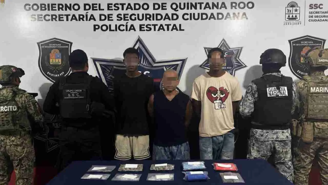 Three Cuban nationals are arrested by police in the parking lot of Market 28 in Cancun.