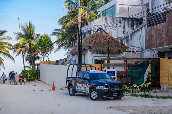 Rental car being towed on a street in Tulum, Mexico