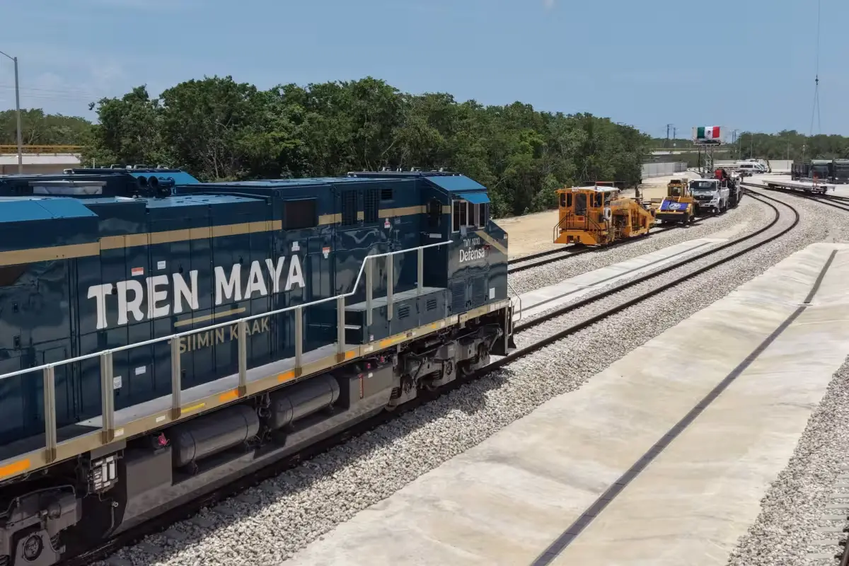 Tren Maya train on tracks with job vacancies announcement