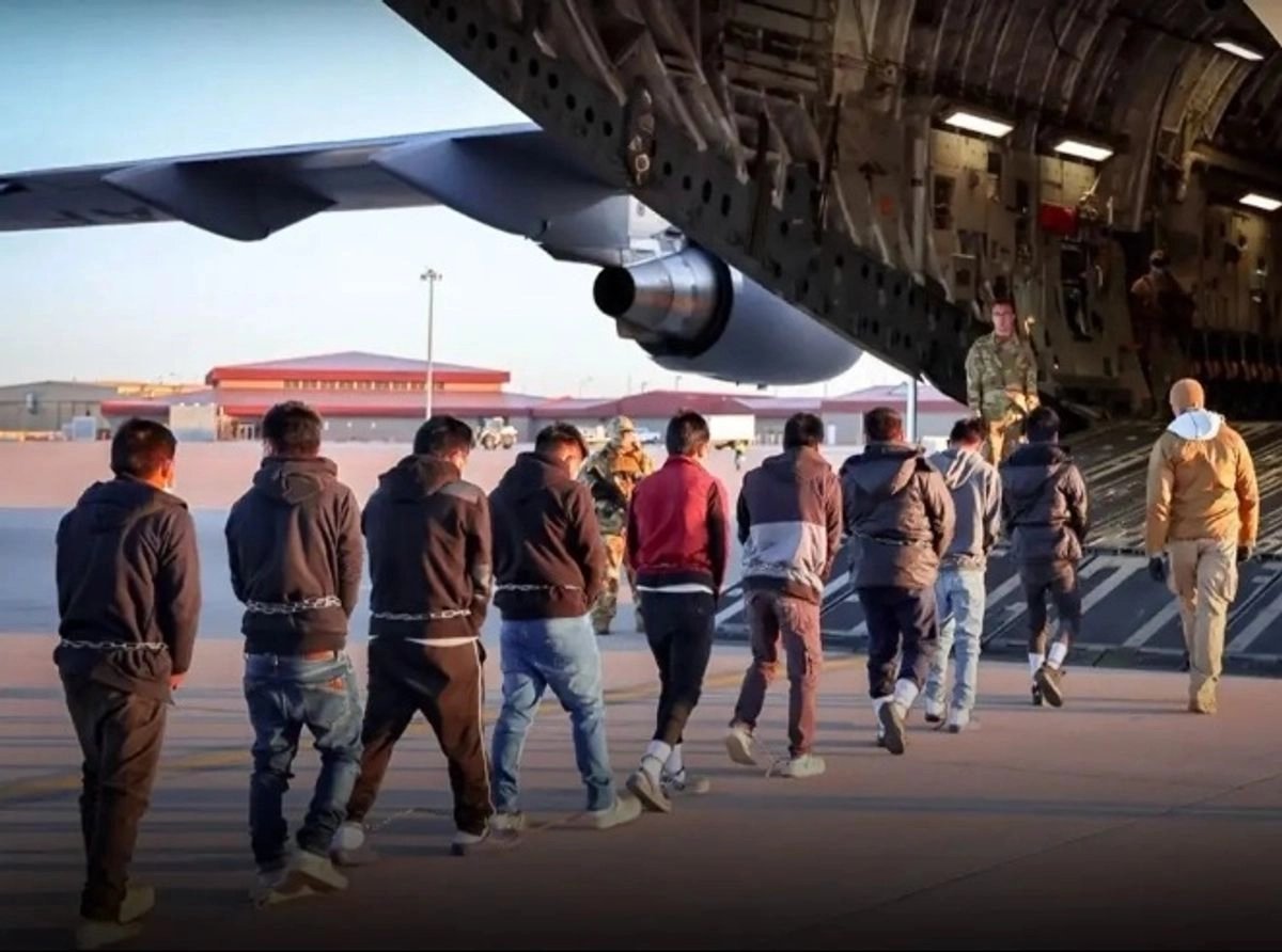 A group of migrants deported from the United States at an airport in Mexico.