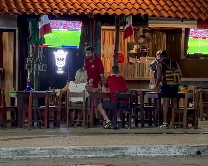 Inspector reviewing food handling practices at a Tulum restaurant