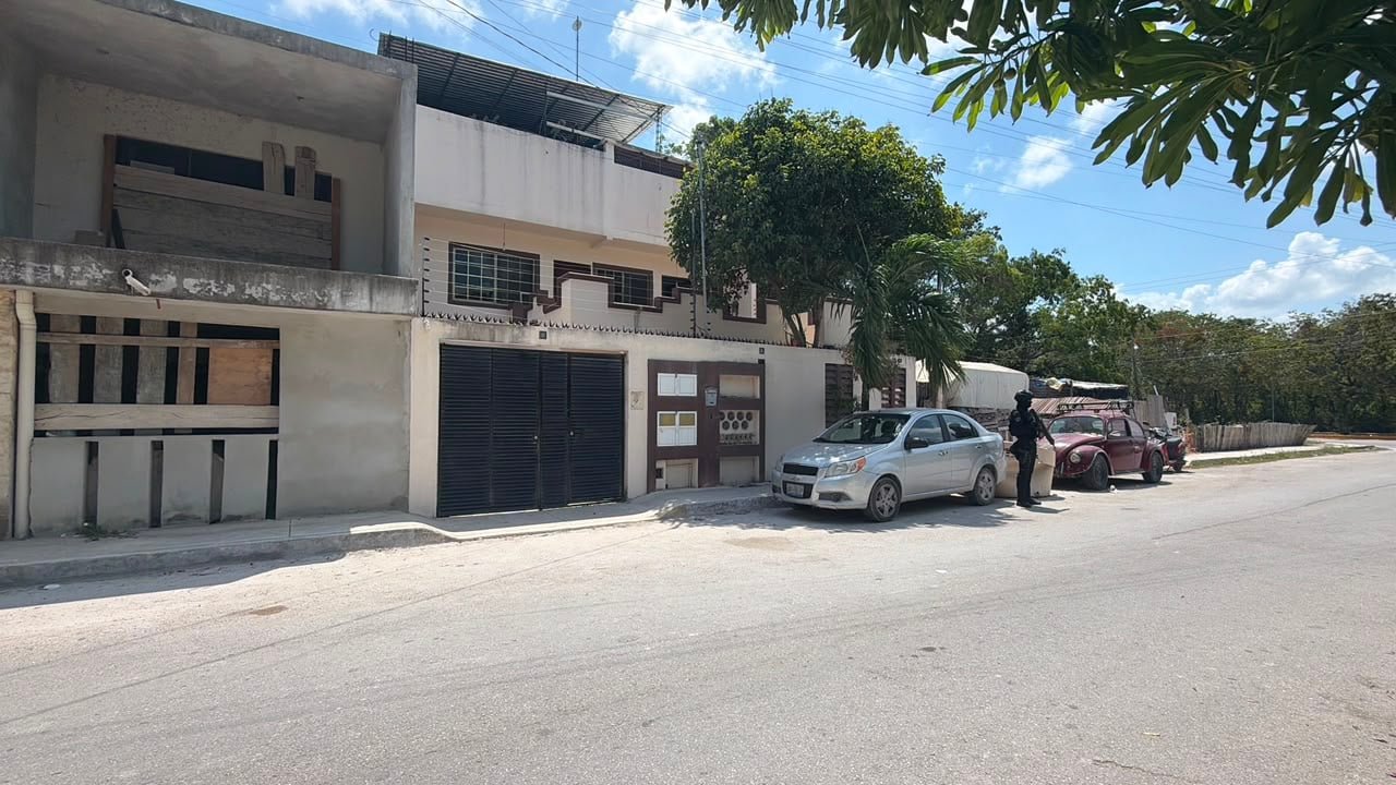 Mexican police officers outside a residence during an operation in Tulum, Quintana Roo