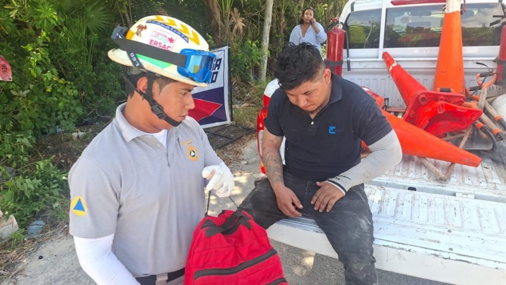 Emergency personnel attend to a worker injured by an electric shock on Avenida Tulum in Tulum, Quintana Roo.