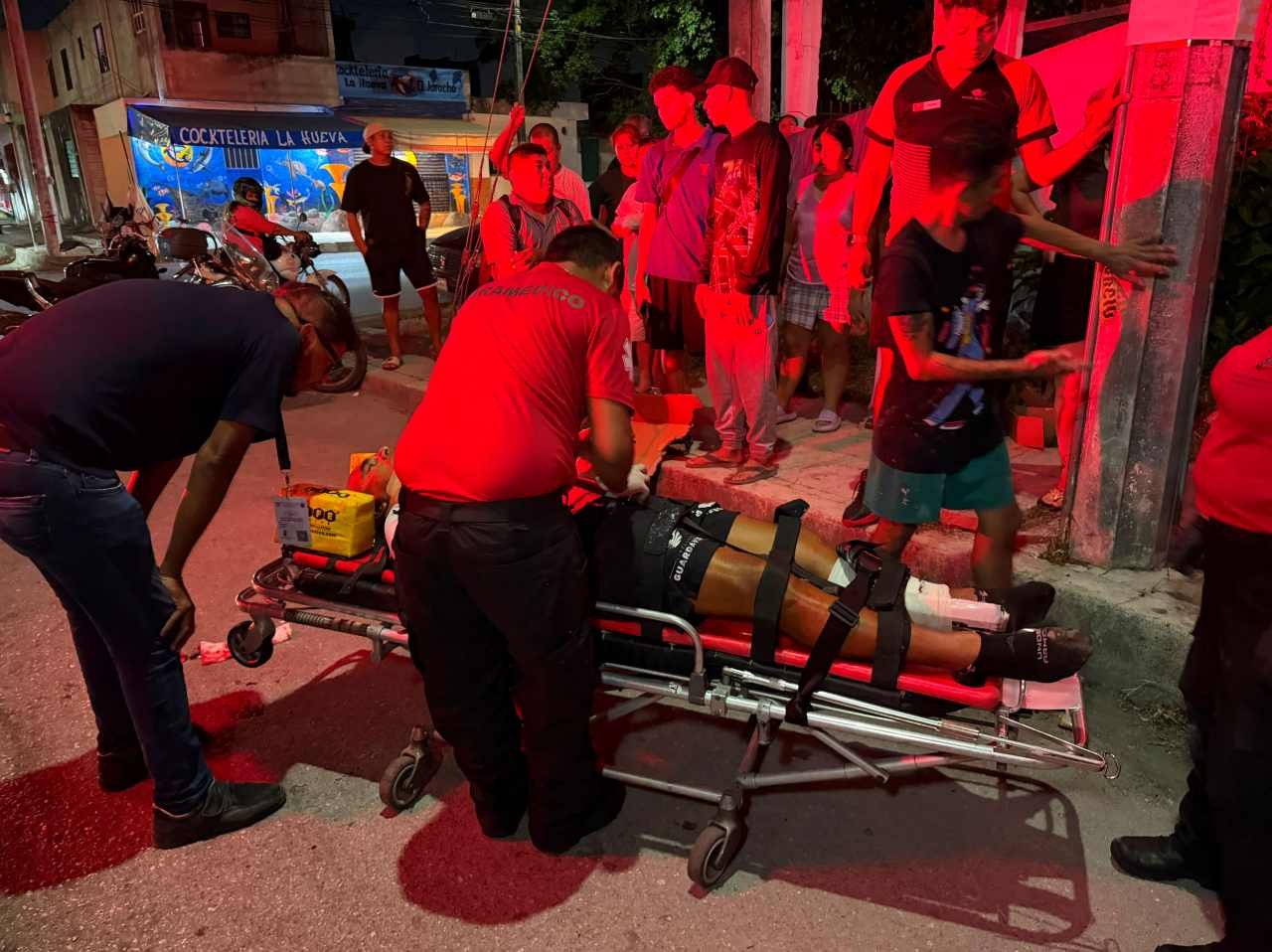 Two Civil Protection officers on a motorcycle after being struck by a pickup truck in Cancun