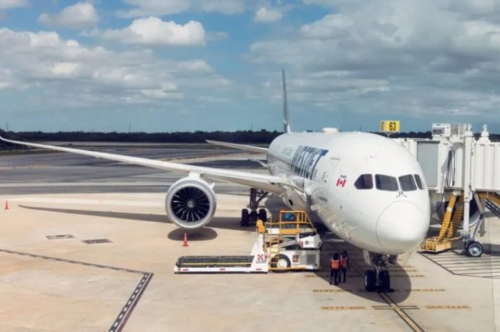A WestJet aircraft parked at Cancun International Airport during a strike that forced 12 flight cancellations.