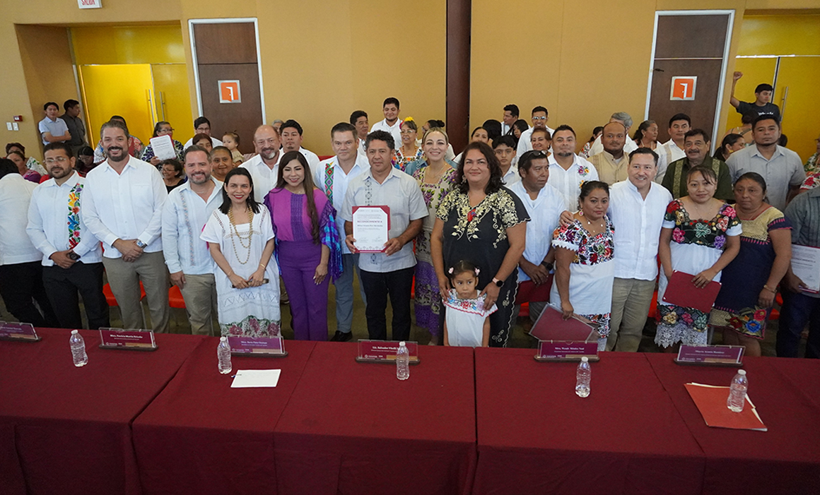 Artisans receive awards at the Gran Museo del Mundo Maya during Yucatan's state embroidery and folk art contests.