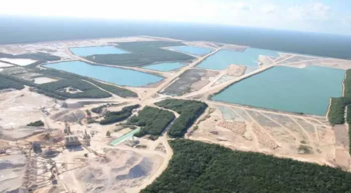 Heavy machinery and limestone stockpiles at the Calica quarry near Playa del Carmen, Quintana Roo