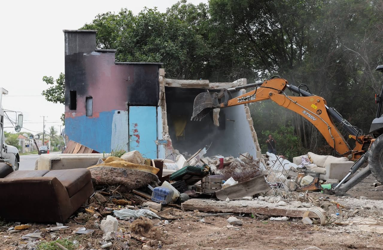 Cleanup crews remove garbage and debris from an illegal dumping site in Cancun, Mexico.
