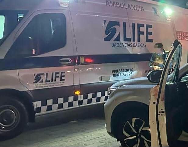 Authorities inspect a vehicle in a hotel parking lot in Cancun where a man was found dead after a stabbing