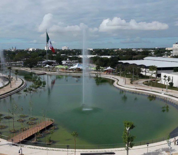 Concept for a proposed park in Cancun with playground equipment, water mirrors, a fountain, and landscaping.