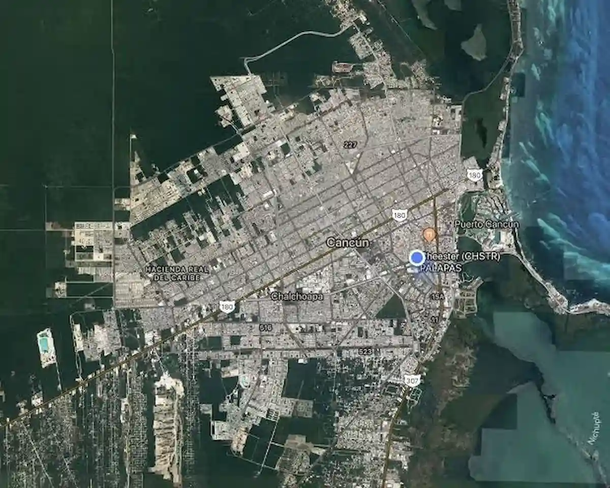 Planners reviewing maps and documents for Cancún's updated urban development program