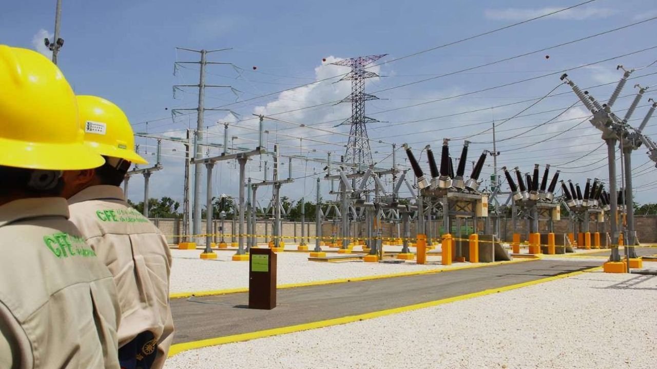 High-voltage transmission towers and power lines carrying electricity across the Yucatan Peninsula
