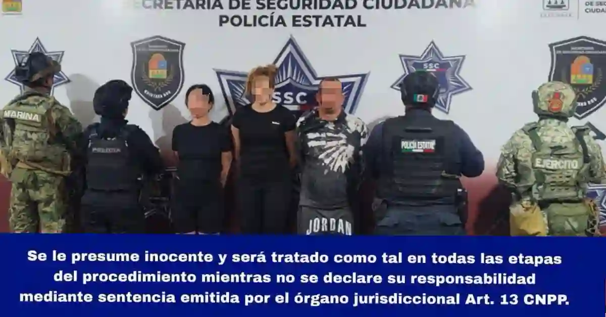 Security personnel at a house in Cancun after four kidnapping victims were rescued and five Cuban nationals were arrested