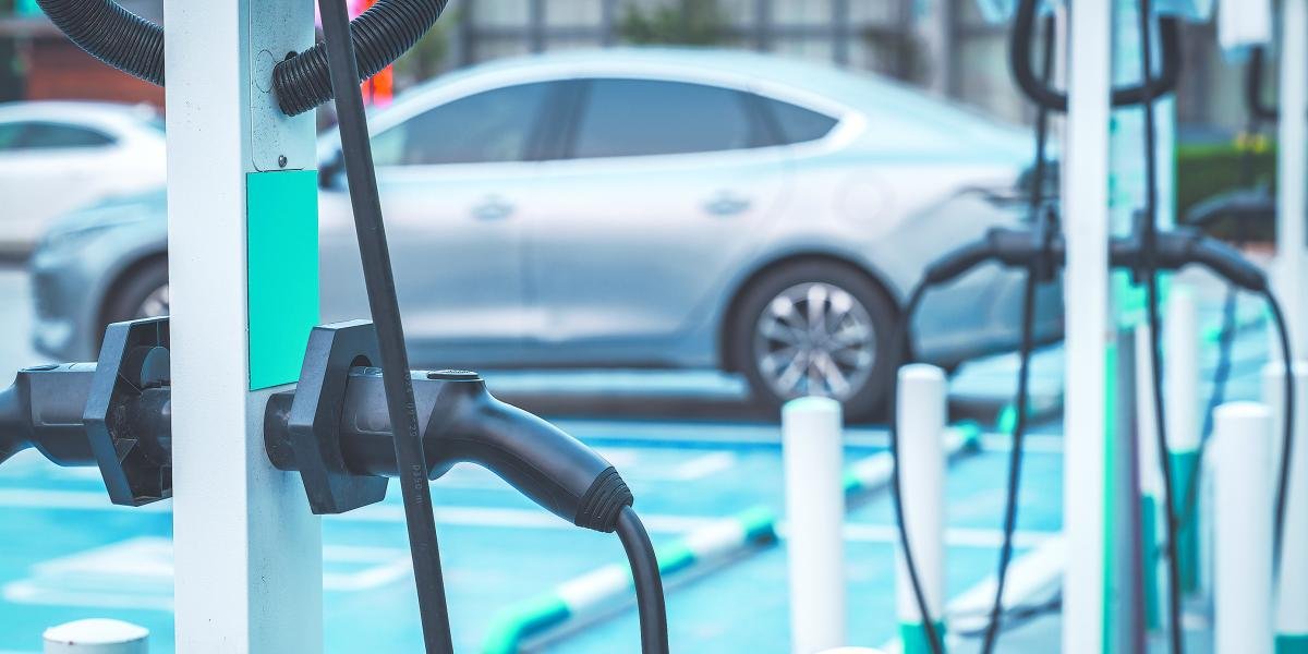 Electric vehicles parked at charging stations in a Mexican city