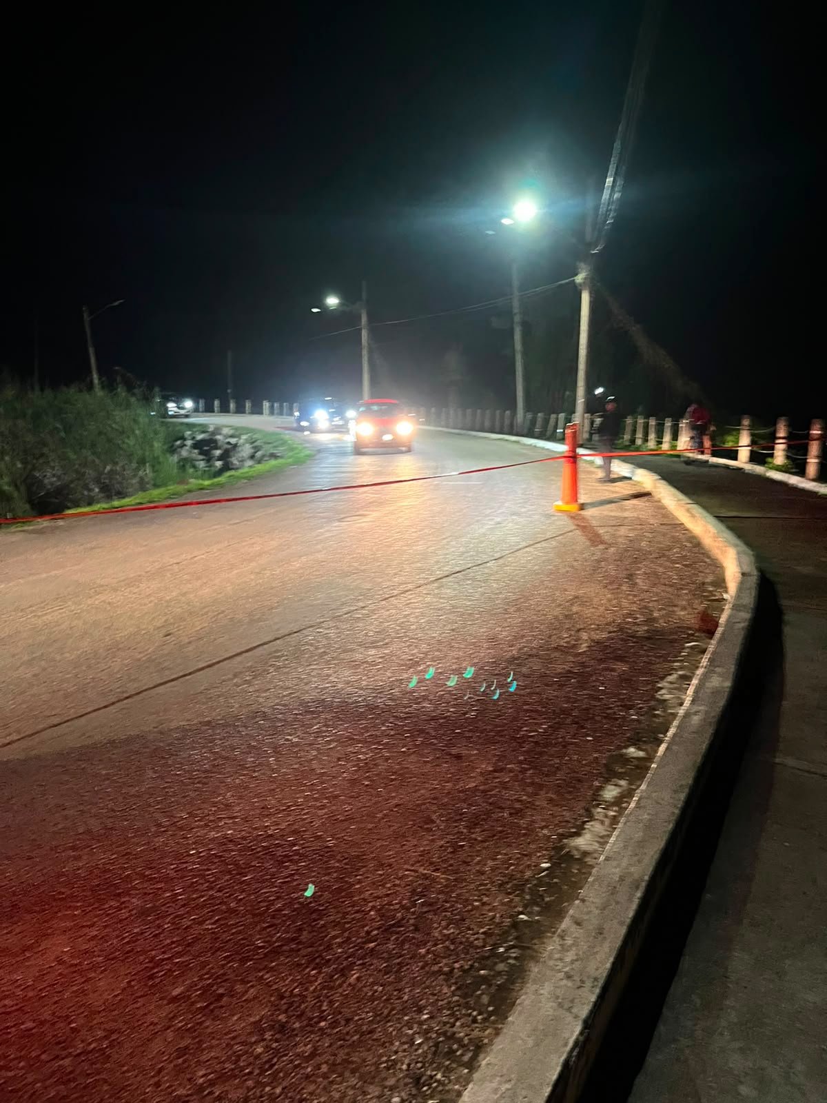Scene of a fatal motorcycle crash on a road along the Cobá lagoon, in Tulum, Quintana Roo