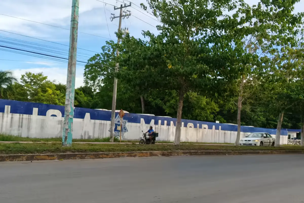 State Prosecutor's Office agents escort police officers from the Municipal Police station in Chetumal.