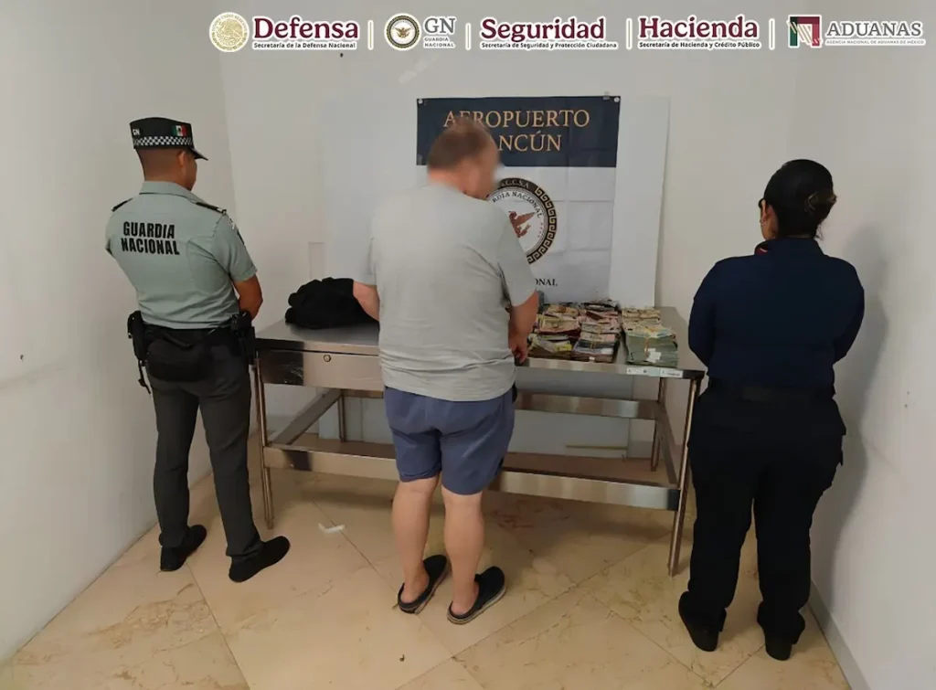 Assorted foreign banknotes and Mexican pesos seized by customs officers at Cancun International Airport.