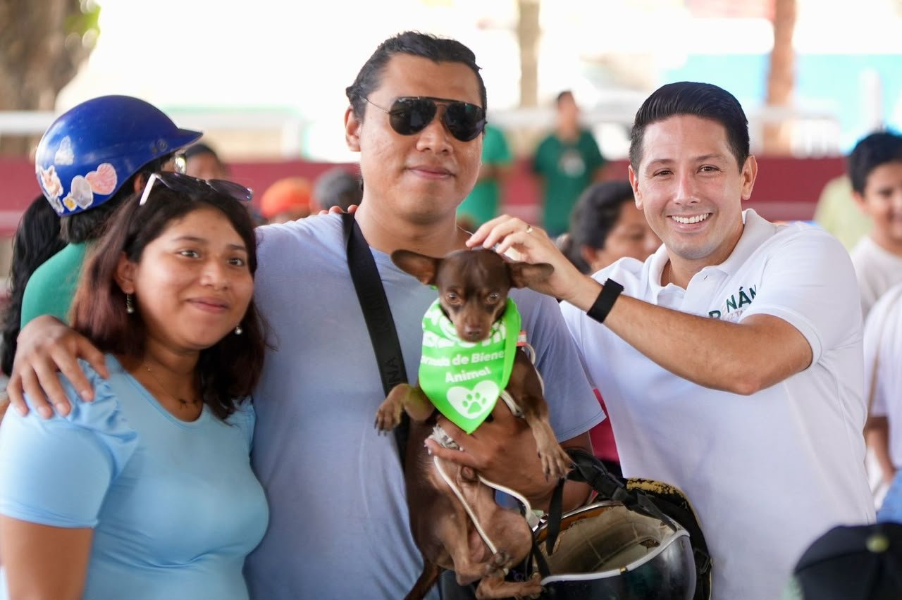 Owners with their dogs and cats at a free rabies vaccination and microchip clinic in Cozumel
