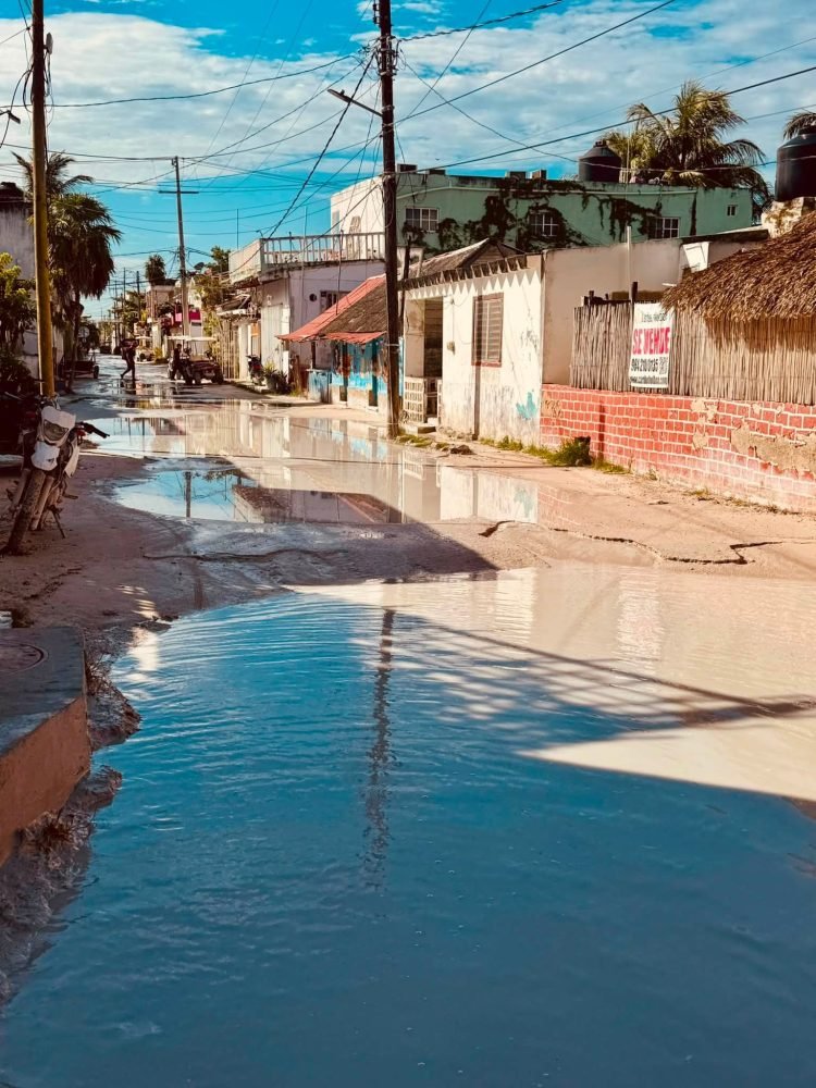 Accumulated garbage and mud-covered streets on Holbox island in Quintana Roo during the peak whale shark tourist season