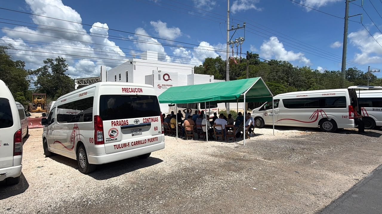 Vehicles moving along the highway between Tulum and Playa del Carmen in Quintana Roo, Mexico, where roadwork and speed-control patrols are in place