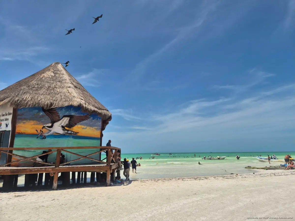 Boats and turquoise water along the beach on Holbox island in Quintana Roo, Mexico