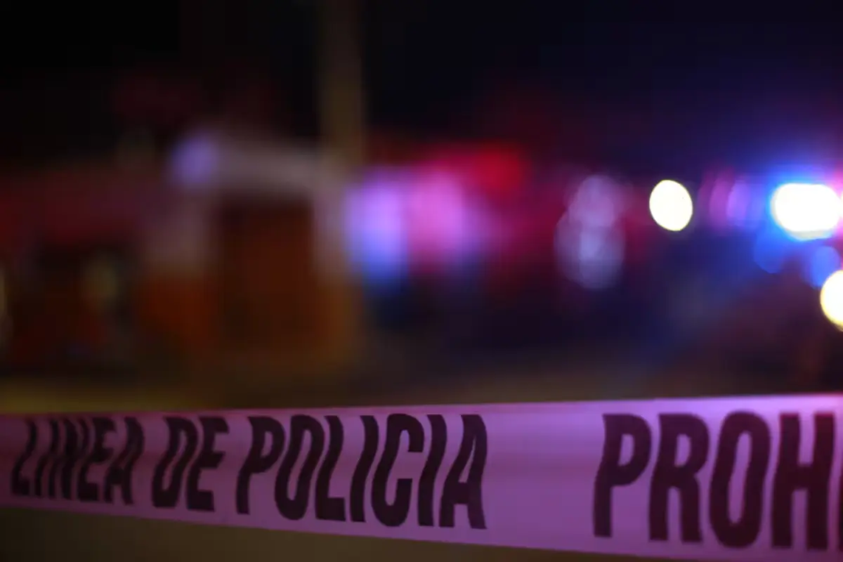 Police tape marks the scene where a white hotel van was found near the Kohunlich archaeological zone in Quintana Roo
