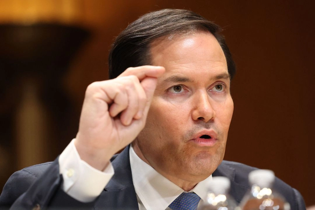 U.S. Secretary of State Marco Rubio speaking during a public appearance in a dark suit