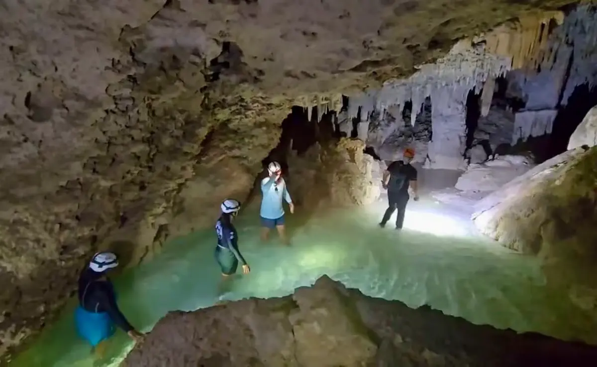 A support pier for the Maya Train Section 5 pierces the ceiling of the Aktun Tuyul cave system in Quintana Roo, Mexico, where the water below shows signs of contamination.