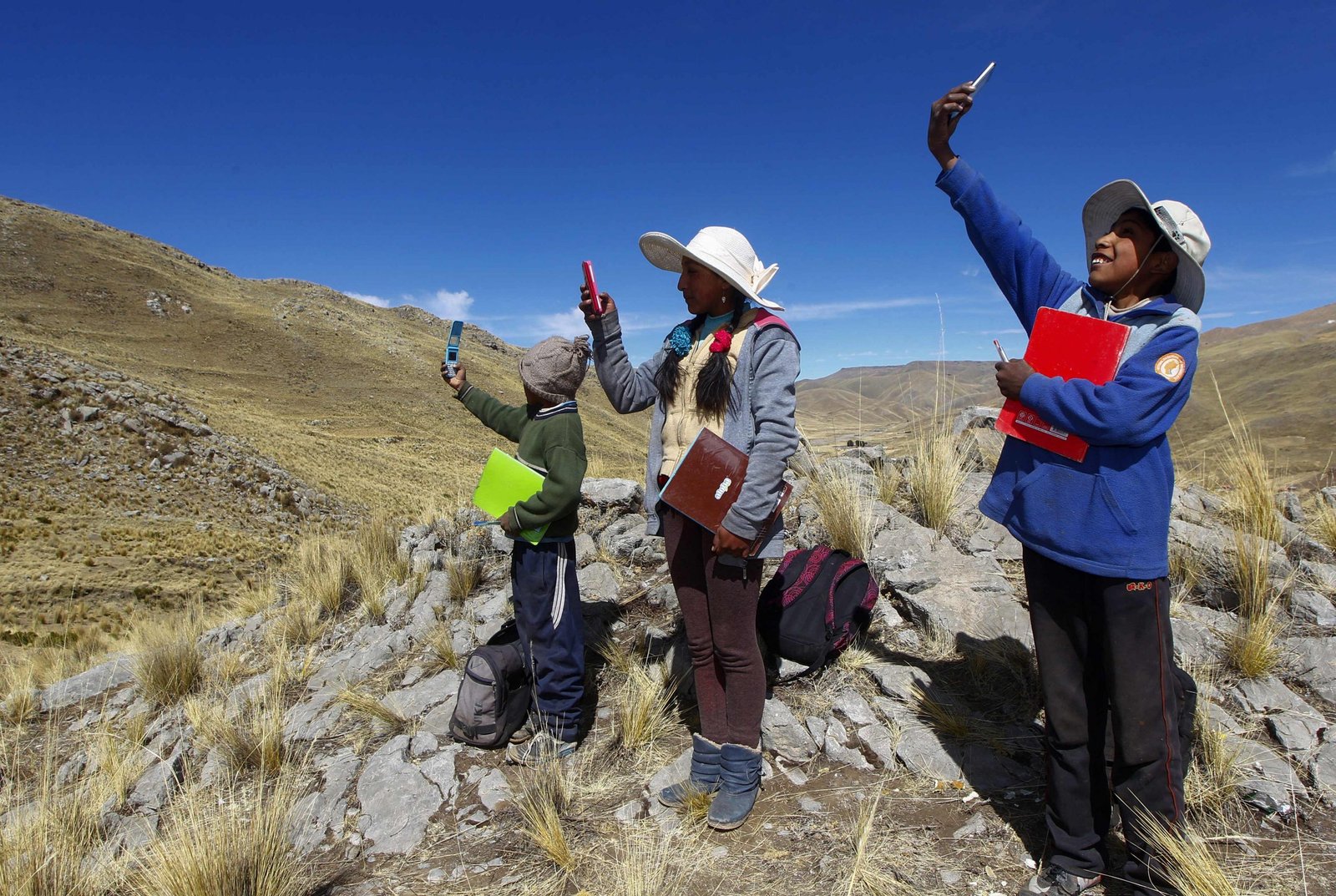 A microwave antenna tower transmitting wireless internet signals toward a small rural community in Mexico