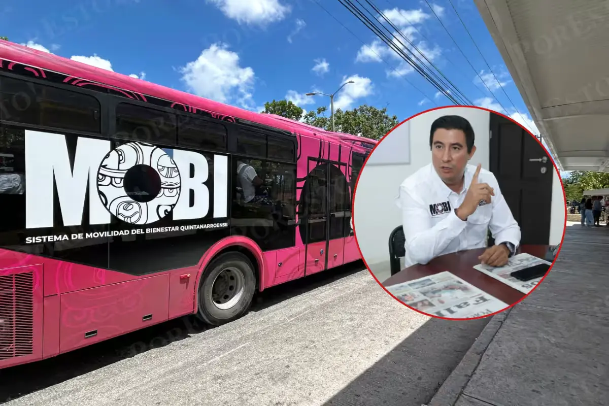 Rafael Hernandez Kotasek, director of Quintana Roo's Mobility Institute, beside new MOBI transit buses in Cancun.