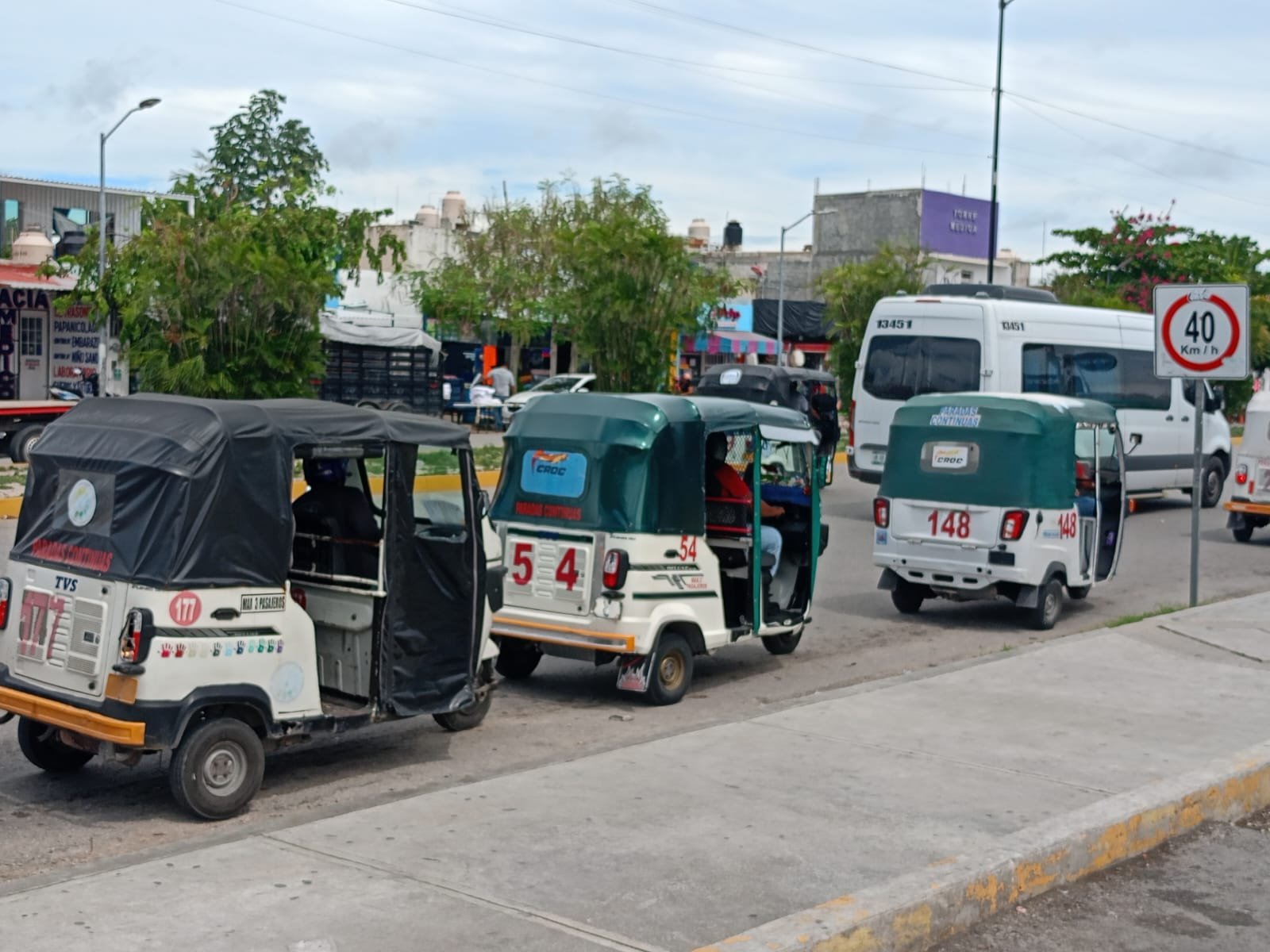Line of mototaxis waiting for passengers on a street in Playa del Carmen, Quintana Roo