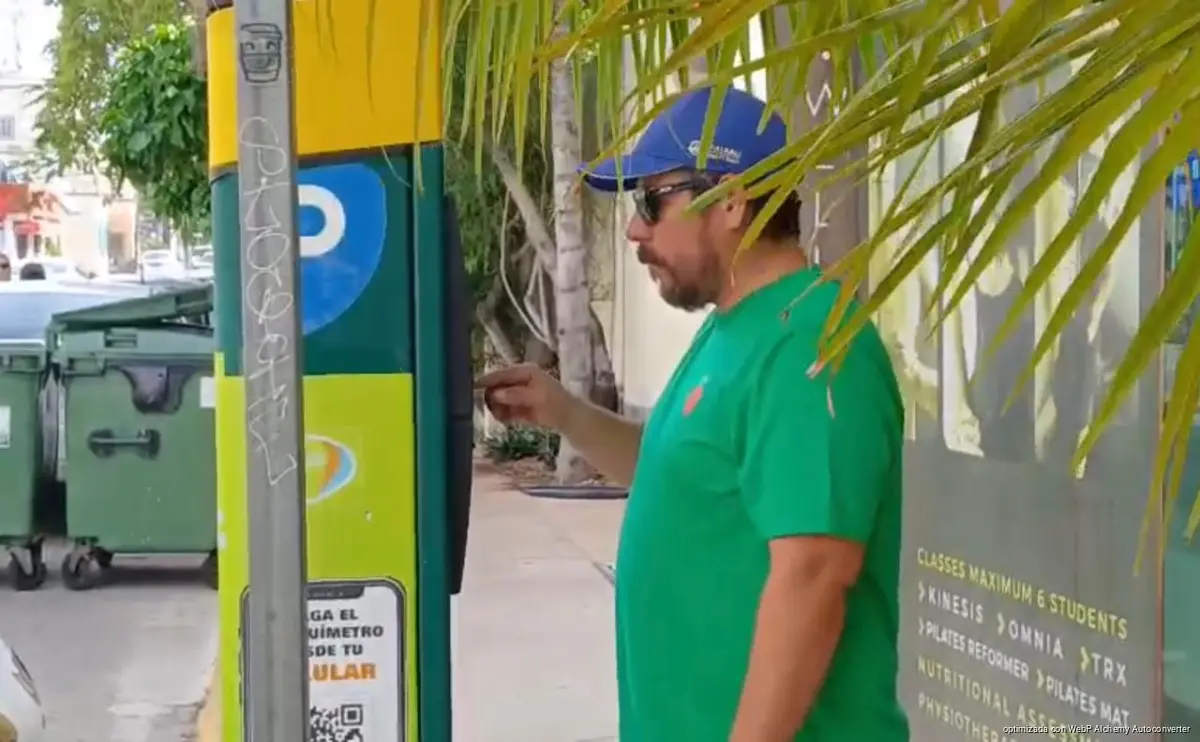 Parking meters and street signage operated by Playaparq in downtown Playa del Carmen, Quintana Roo