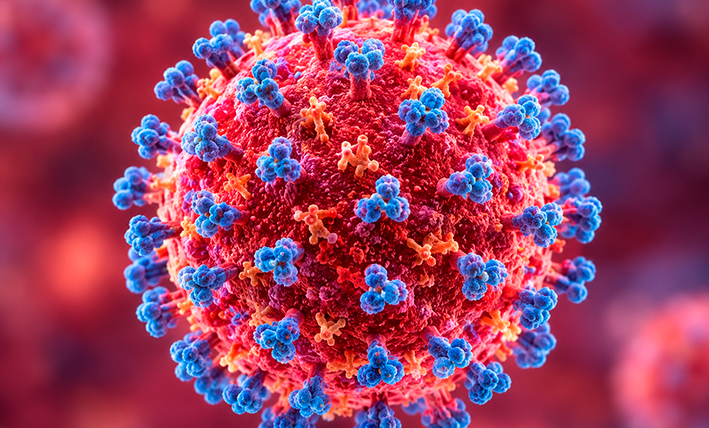 Illustration of measles virus particles alongside a vaccination syringe representing the measles outbreak in Quintana Roo, Mexico