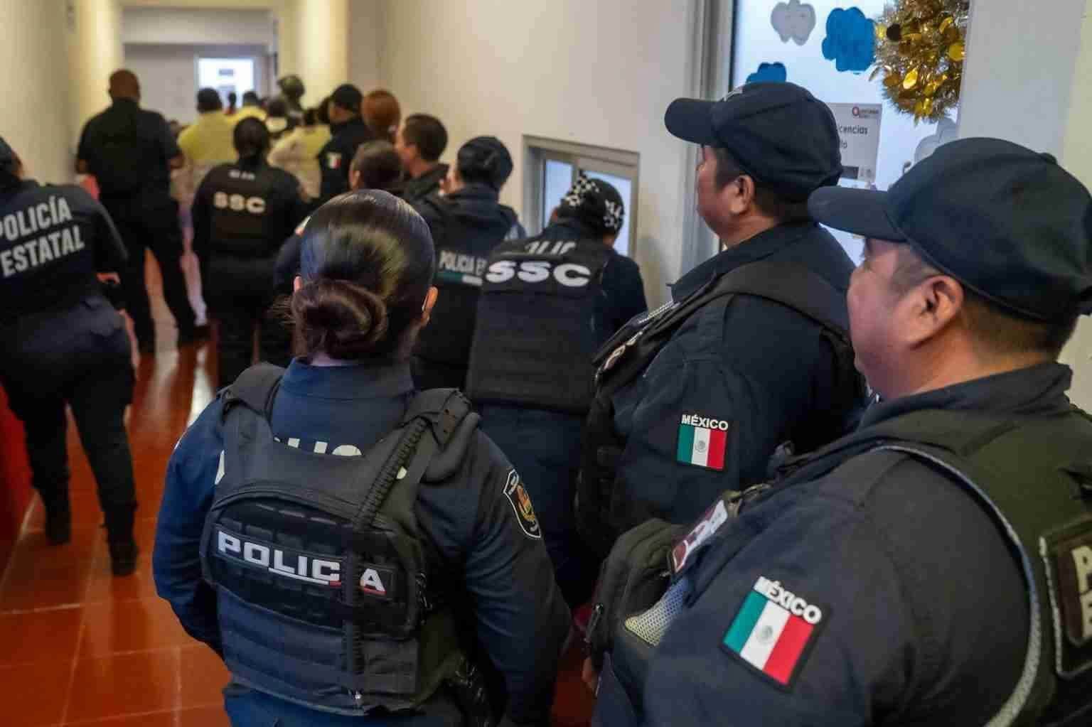 Quintana Roo police officers stand in formation during a surprise anti-drug screening ordered by the state trust-control center