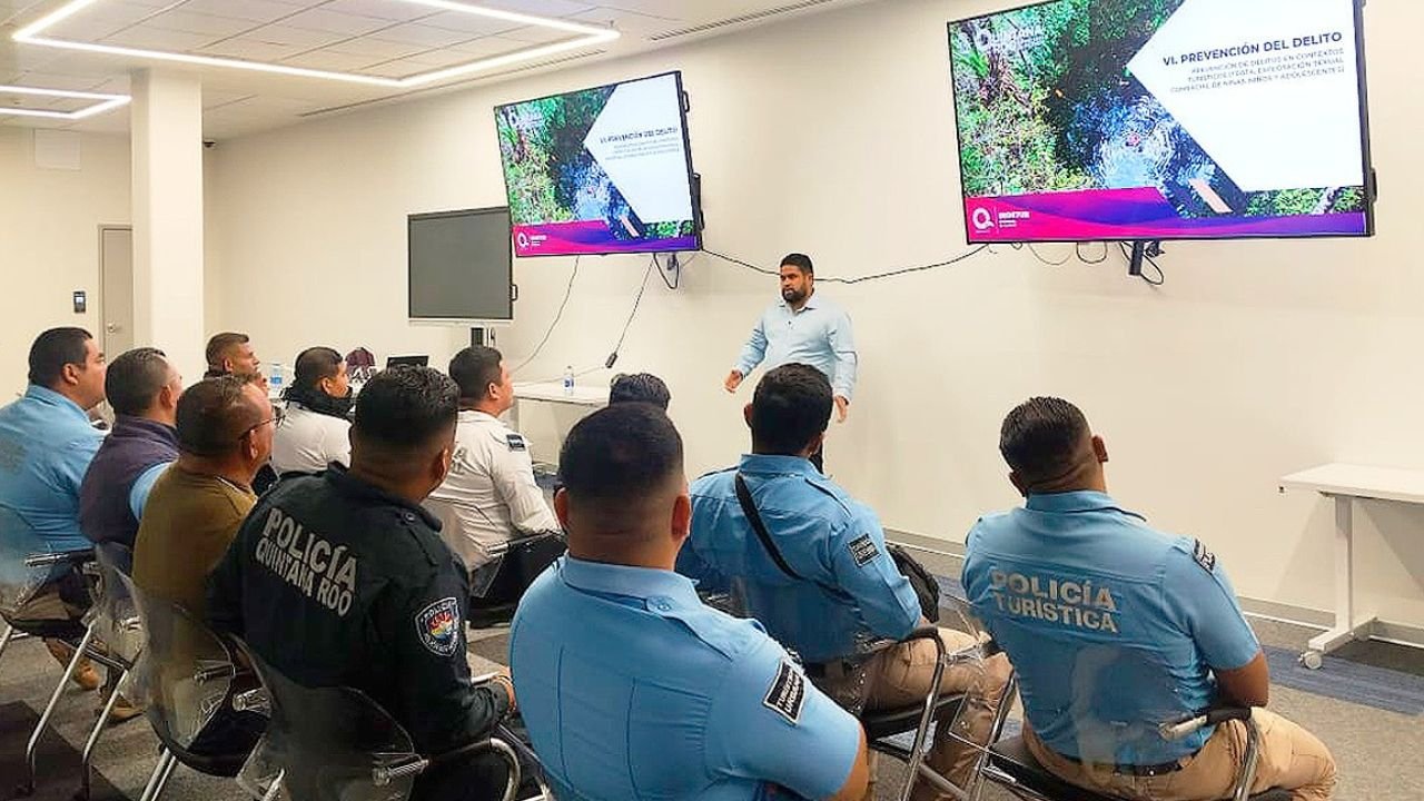 Tourist police officers in Quintana Roo stand in formation during a training and professionalization program