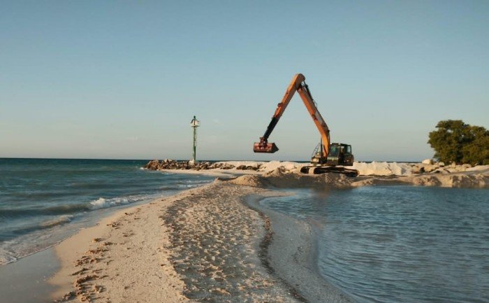 Mexican Navy personnel conducting emergency dredging at the port of Sisal in Yucatan, Mexico