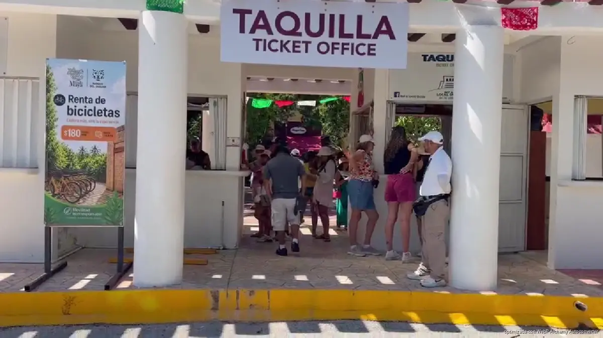 A tour guide leads visitors through the archaeological zone of Tulum in Quintana Roo near the Caribbean coast