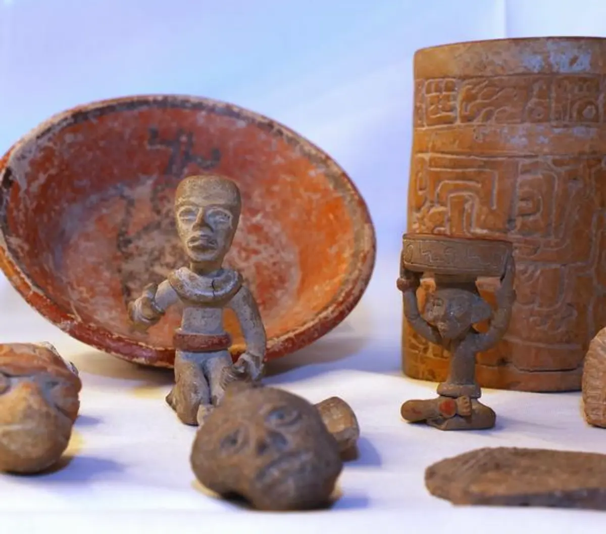 Restored pre-Hispanic vessels and stone artifacts recovered during archaeological salvage work for the Tren Maya in Quintana Roo