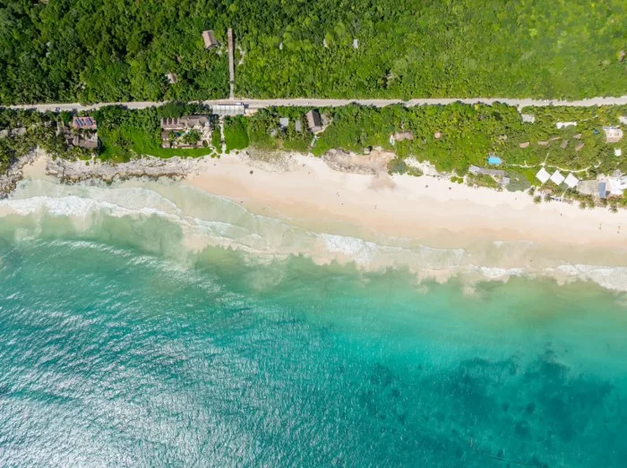 Tourism service providers gather at a registration point in Tulum for the Jaguar Park certification program
