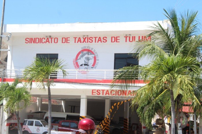 Members of the Tiburones del Caribe taxi union in Tulum with their vehicles