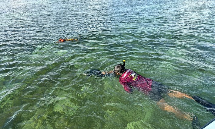 Fishermen and researchers gather larval fish samples in the Zaragoza Canal area of Chetumal Bay in Quintana Roo