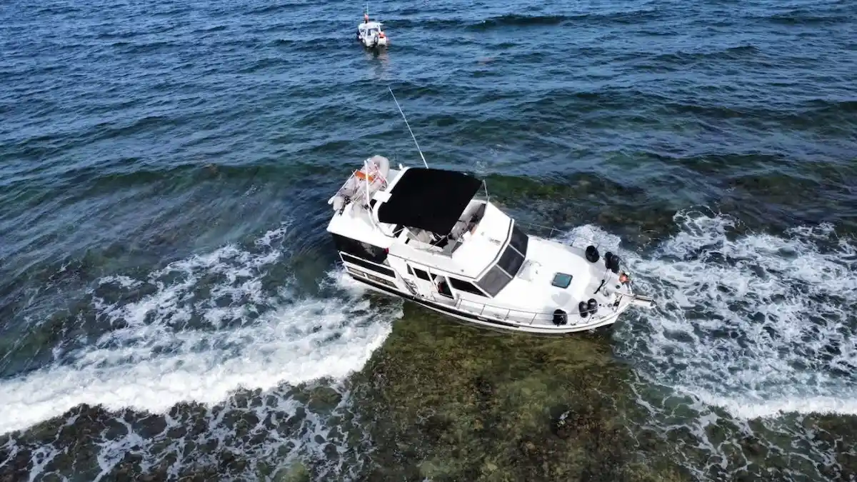 The yacht Isla Caribe III aground on the reef a few meters off the beach at Mahahual, Quintana Roo