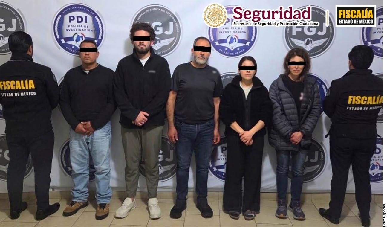 Police vehicles and seized cellphones outside a property in Metepec, State of Mexico, where authorities say a family ran an AI voice-cloning extortion ring targeting public officials