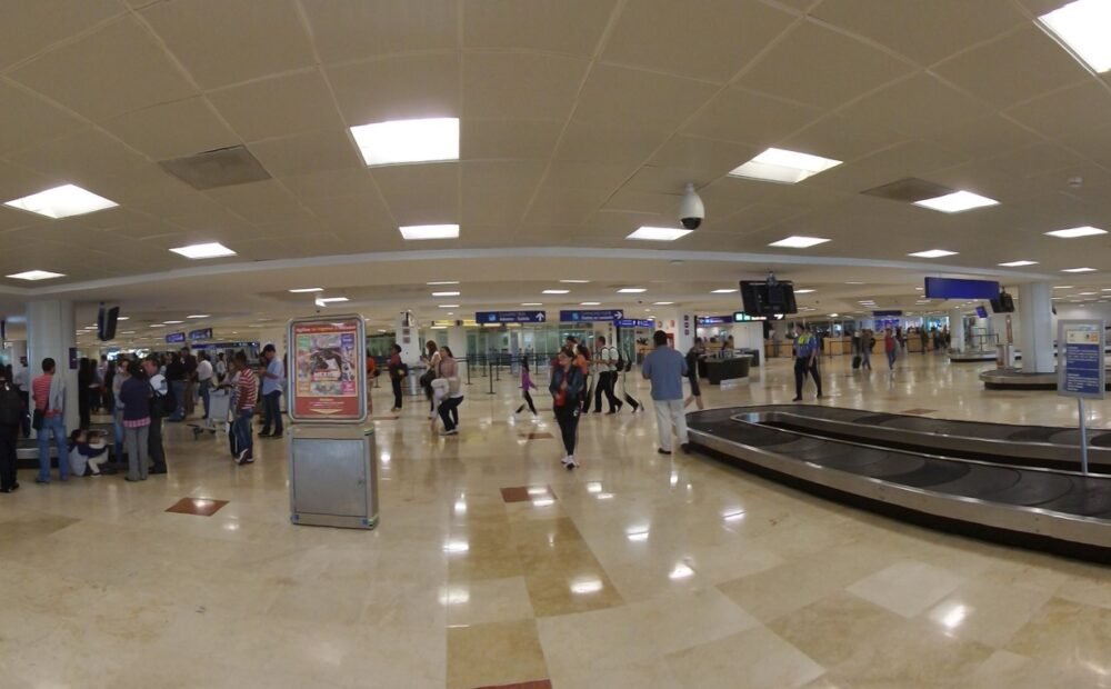 Passengers and officials gather at Cancún International Airport during a ceremony marking 15 years of Air France's Paris-Cancún route