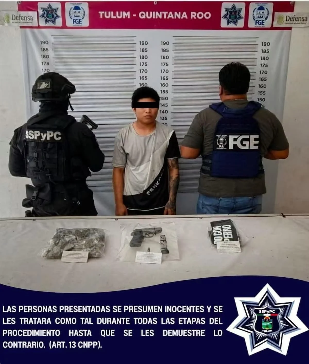 A police officer stands next to a young man being processed while displaying seized items on a table in Tulum, Quintana Roo, Mexico.$# CAPTION
