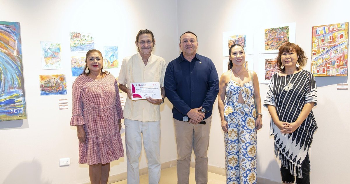 Visitors view paintings, drawings and sculptures at the Arte mas Arquitectura exhibition by Jose Manuel Saenz Txepo inside the Museum of the Island in Cozumel