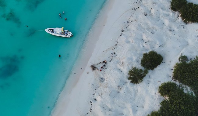 Boats anchored near the shoreline of Arrecife Alacranes National Park off the coast of Yucatan, Mexico