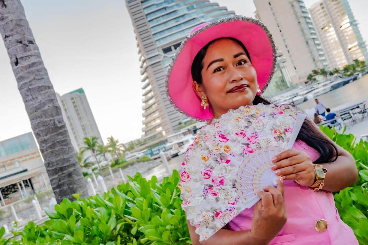 A woman holds a honey jar used to raise funds for free breast prostheses for cancer survivors in Quintana Roo