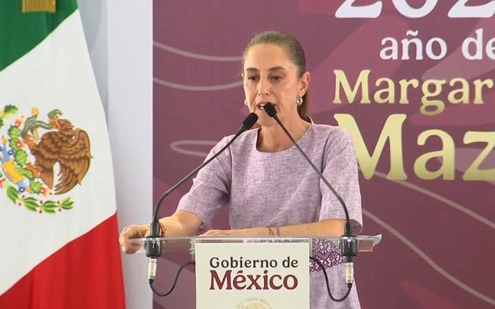 Mexican President Claudia Sheinbaum speaks at a podium bearing the Government of Mexico seal during a public event