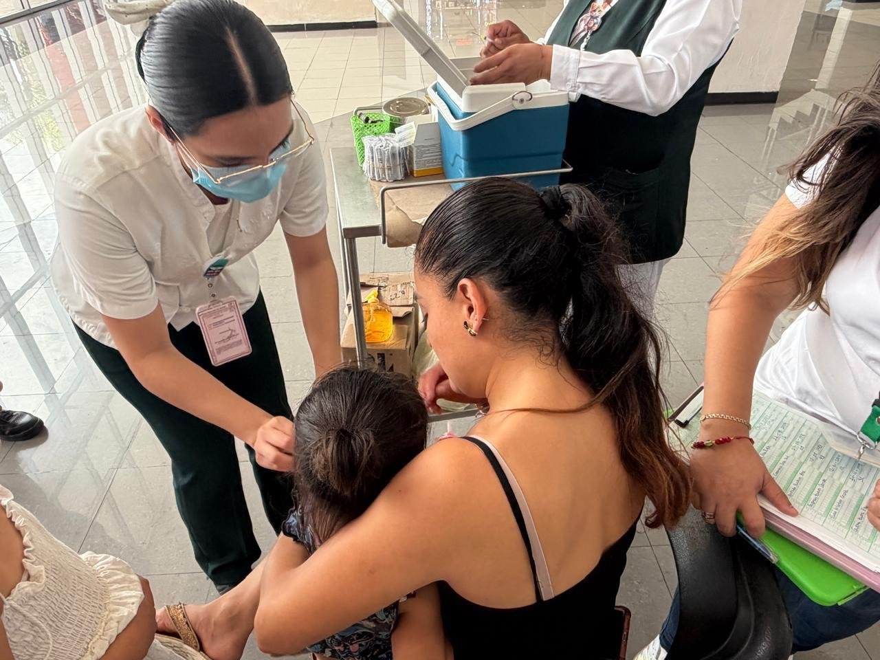 A health worker prepares a vaccine dose at a clinic in Quintana Roo, Mexico
